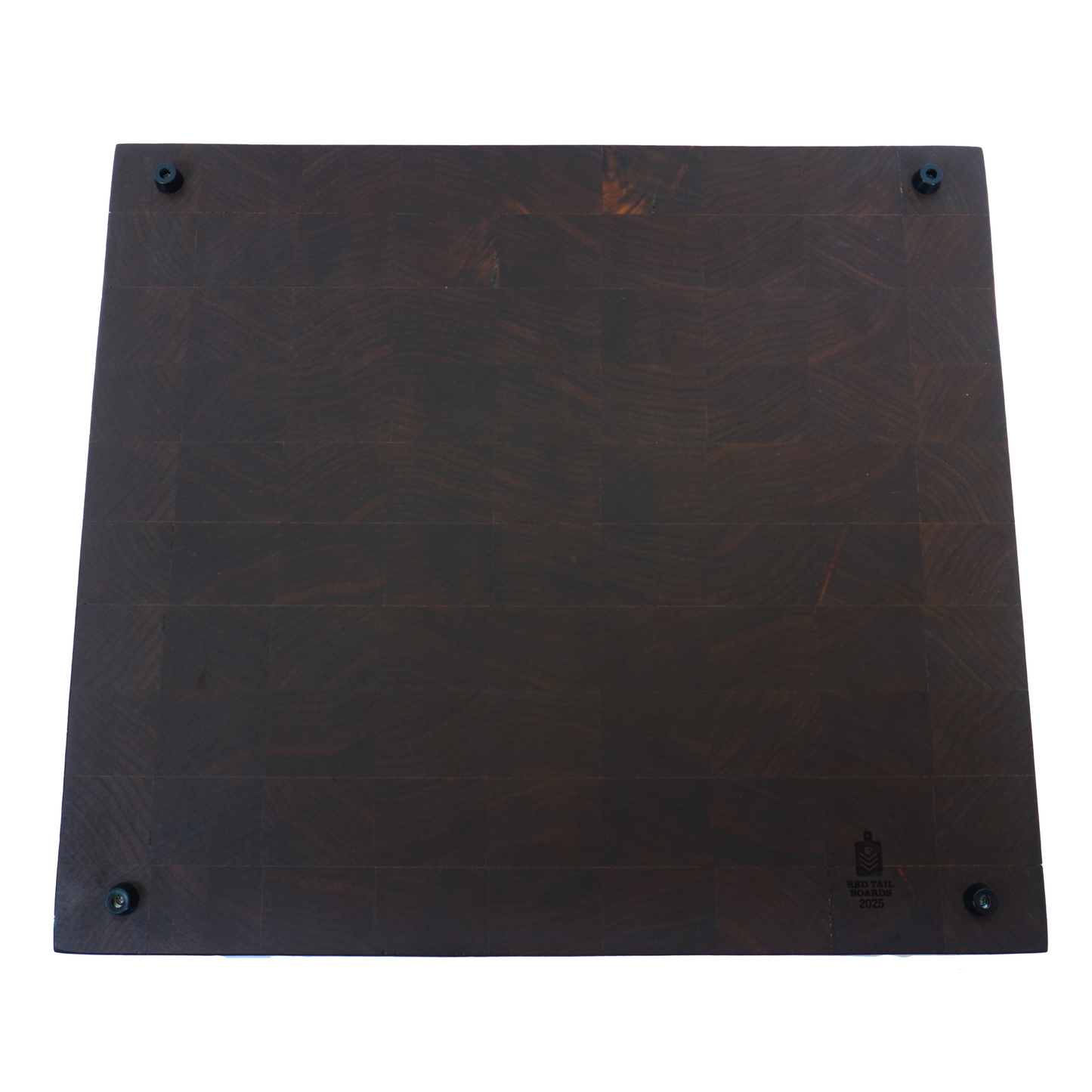 The underside of a Hattori Hanzo walnut end grain cutting board, showcasing the smooth food-safe finish and durable construction details.