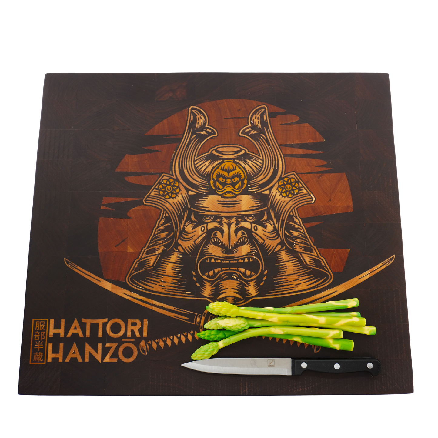 Top-down flat lay of the Hattori Hanzo end grain cutting board with fresh asparagus, highlighting the functional surface area and the vibrant yellowheart inlay against the walnut wood.