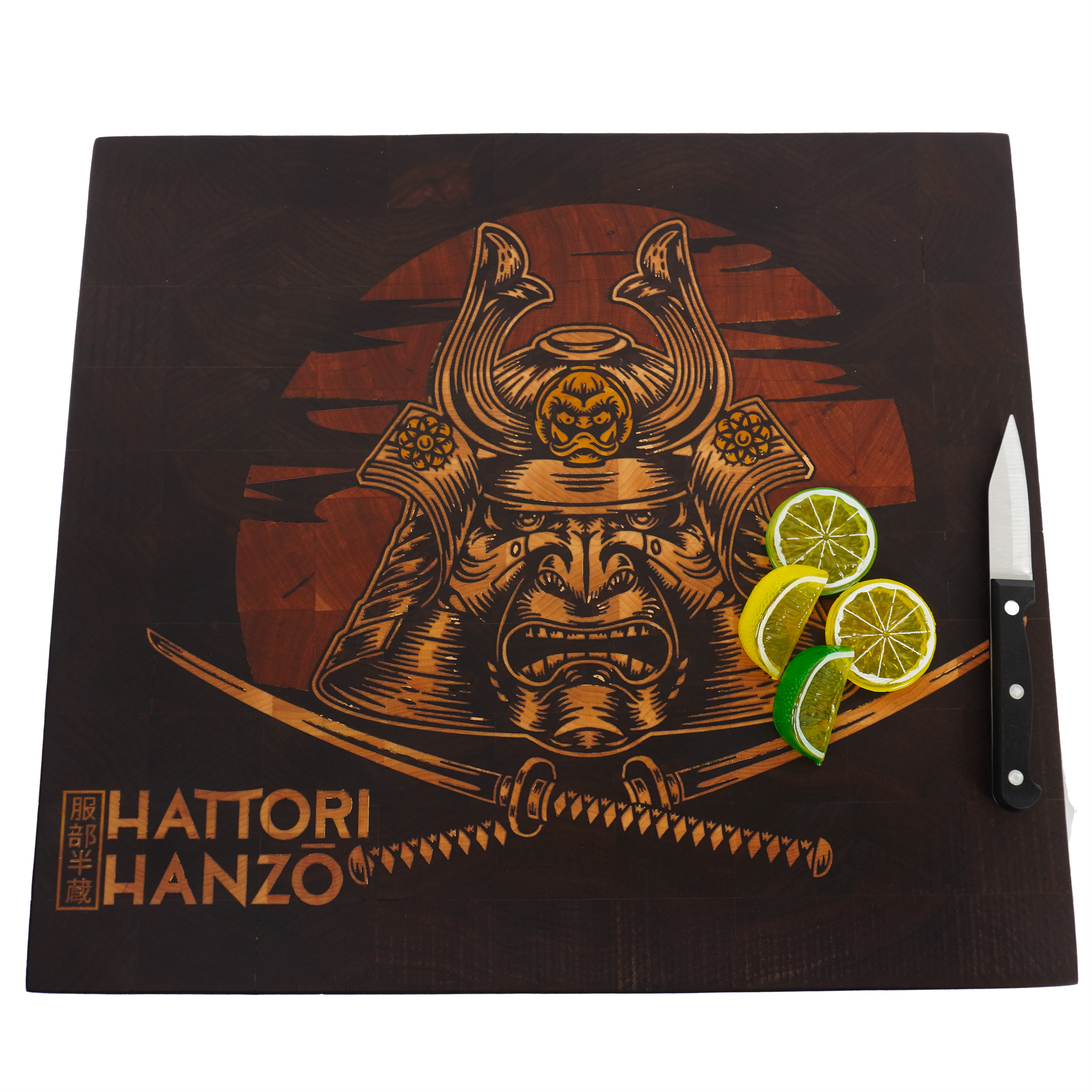 Flat lay view of a Hattori Hanzo end grain cutting board featuring bright lemon and lime slices positioned to highlight the zero-gap precision of the yellowheart sword inlay against dark walnut grain.