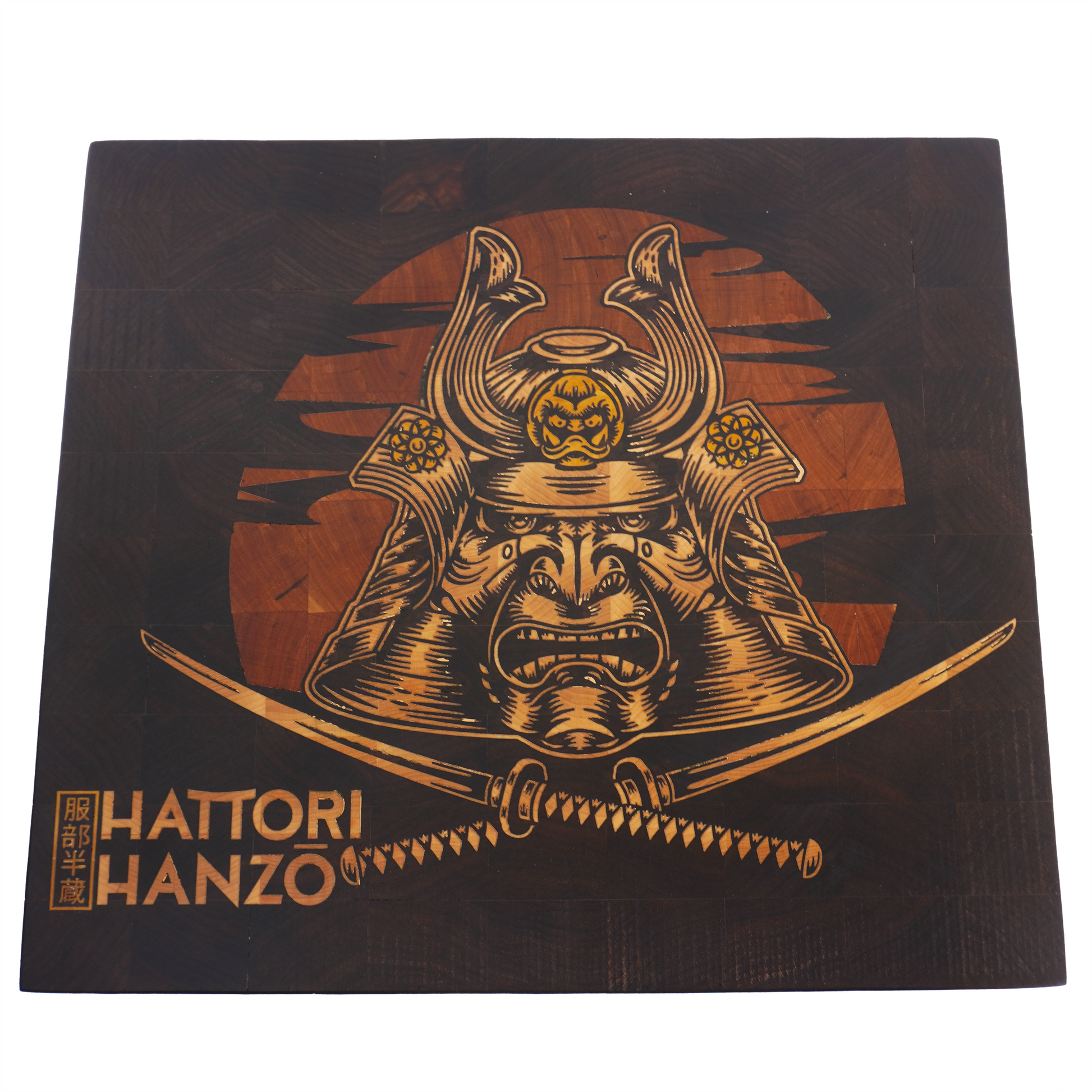 flat lay view of a handcrafted Hattori Hanzo end grain cutting board, highlighting the expansive walnut grain and the vibrant yellowheart sword inlay achieved through precision CNC technology.