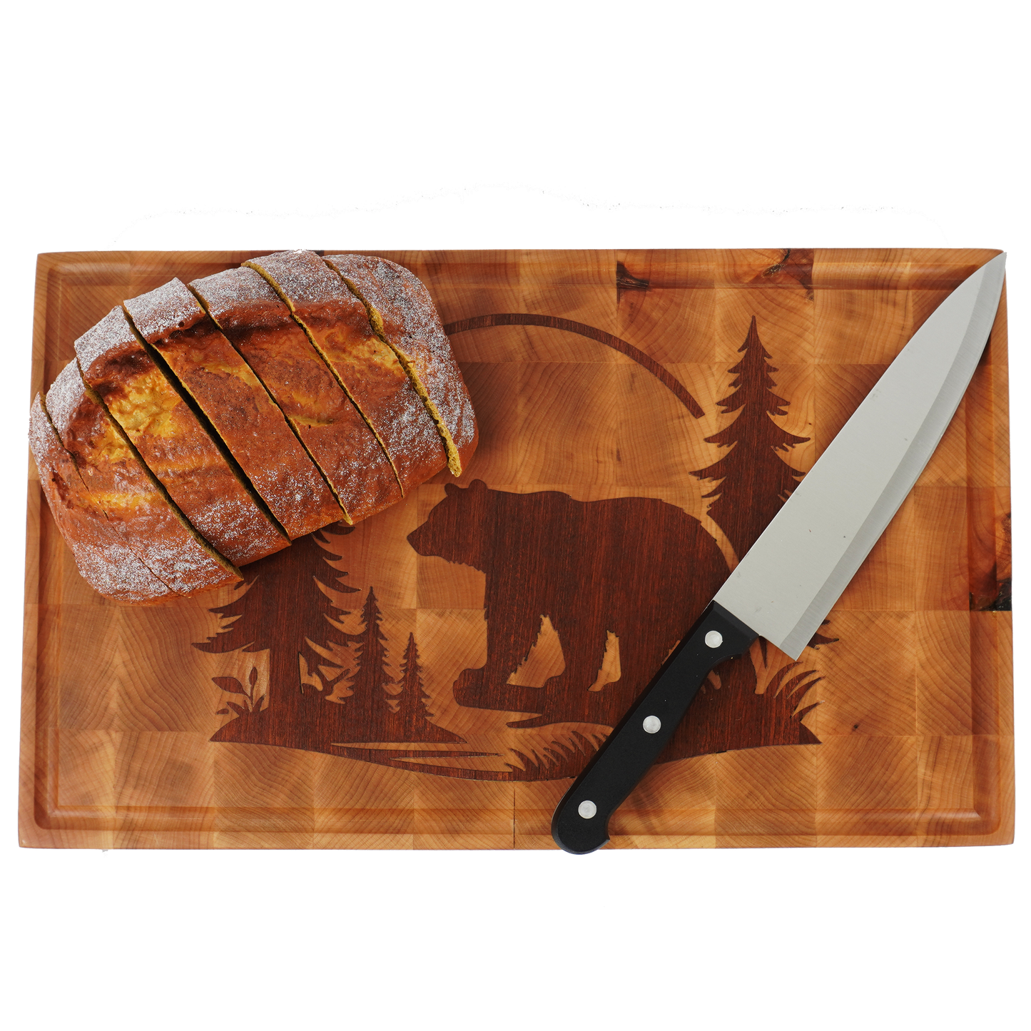 Overhead view of a large artisan bread loaf on the light maple wood of the Kodiak Sovereign.