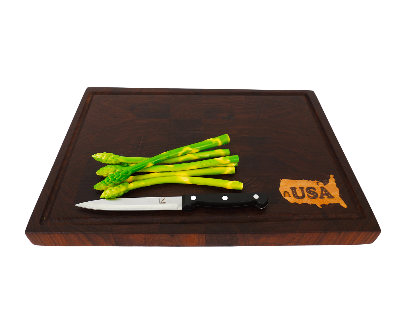 45-degree angled view of the Patriot Sovereign board staged with asparagus.