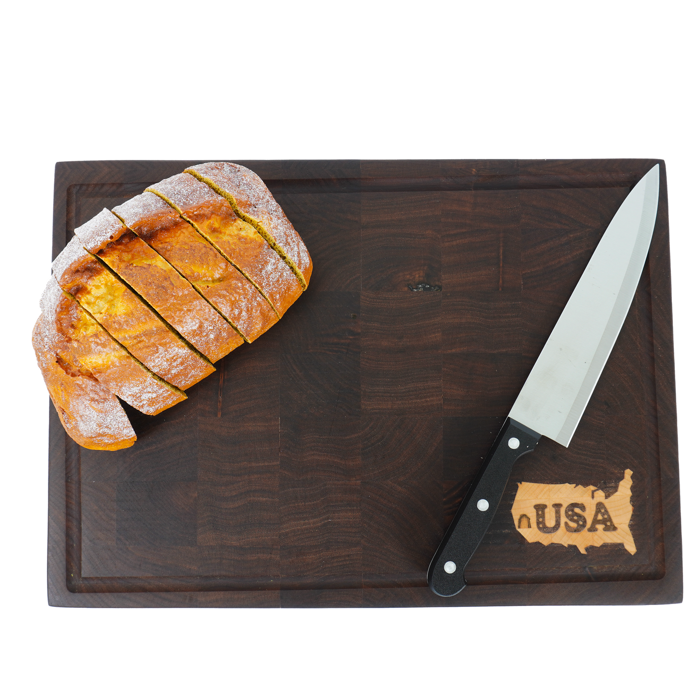Overhead view of a loaf of bread on the Patriot Sovereign, showcasing its use as a large serving or slicing board.