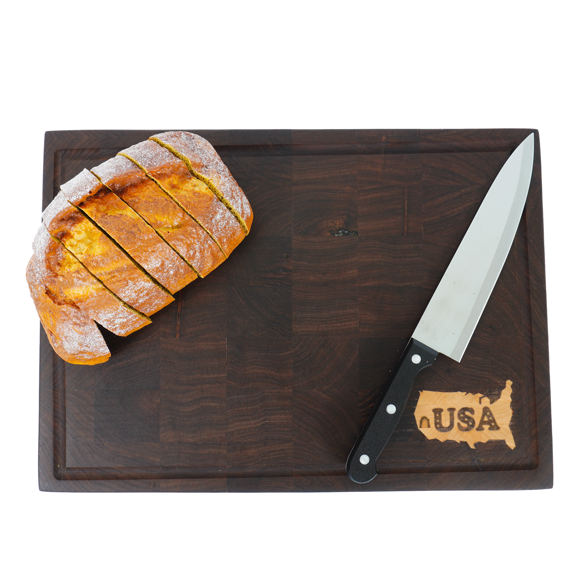 Overhead view of a loaf of bread on the Patriot Sovereign, showcasing its use as a large serving or slicing board.