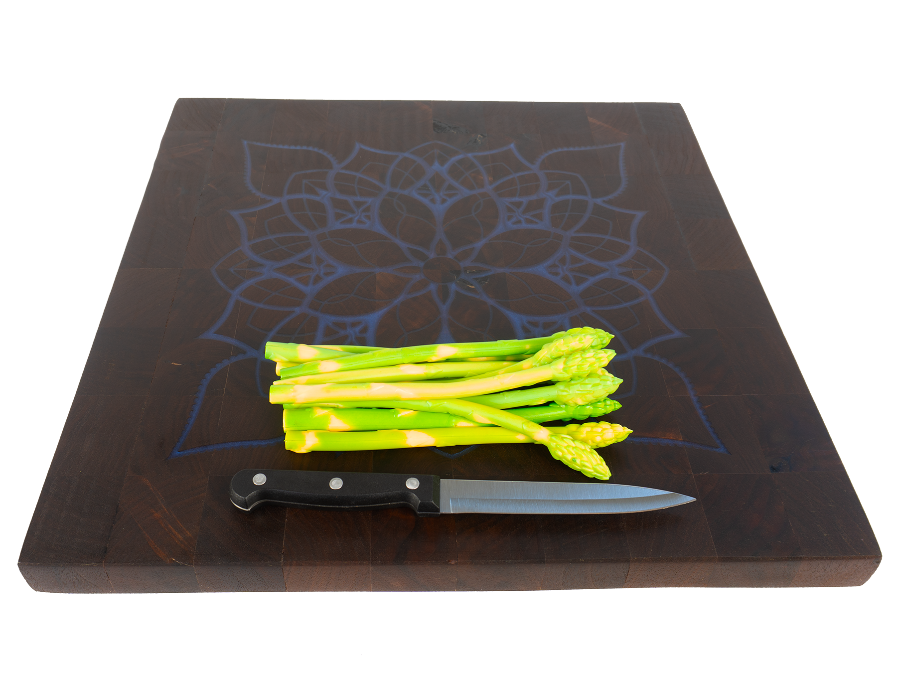 Special edition walnut end grain mandala board with asparagus and knife angled — Red Tail Boards
