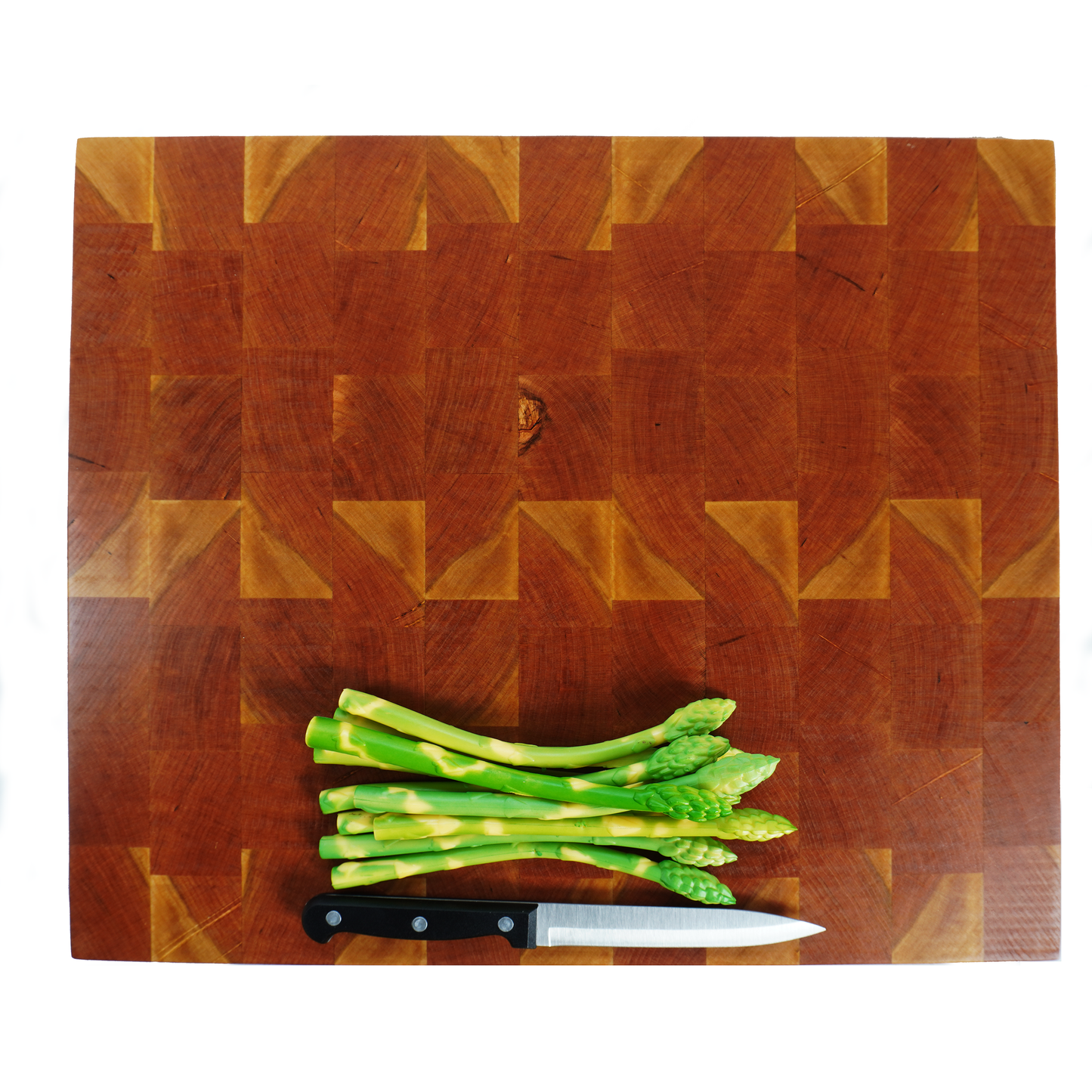 Cherry end grain cutting board with asparagus and knife, top down view
