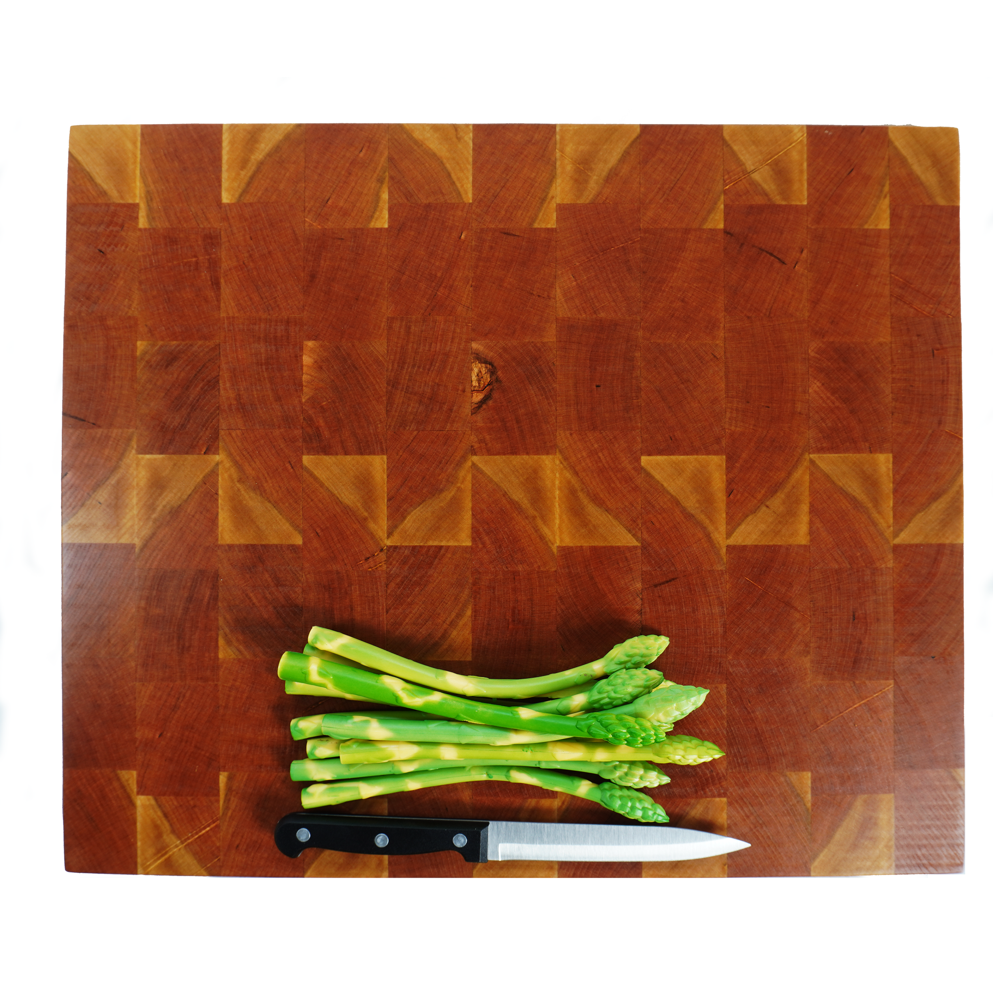 Cherry end grain cutting board with asparagus and knife, top down view
