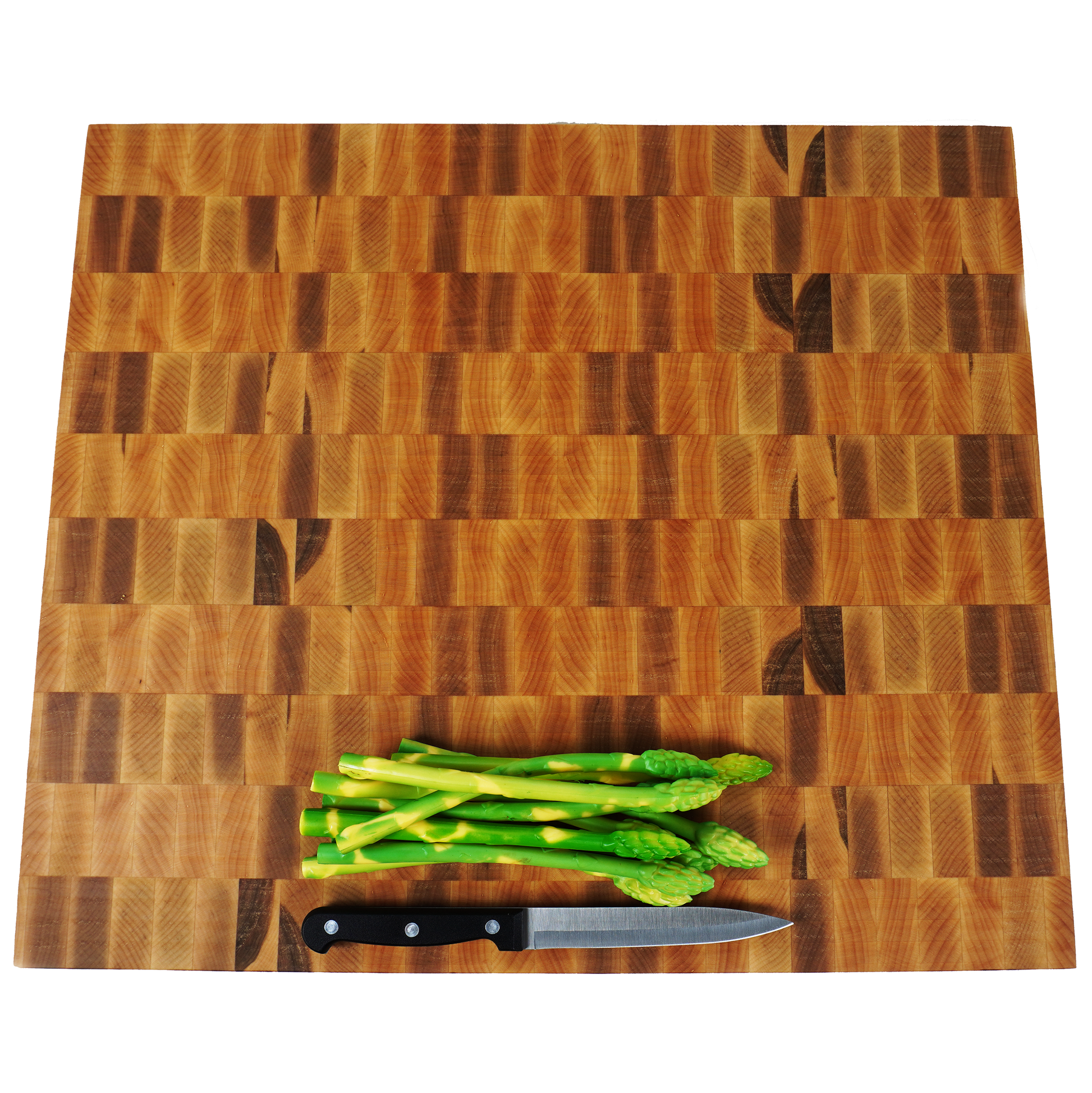 Top down view of maple end grain cutting board with asparagus and knife, handmade in California