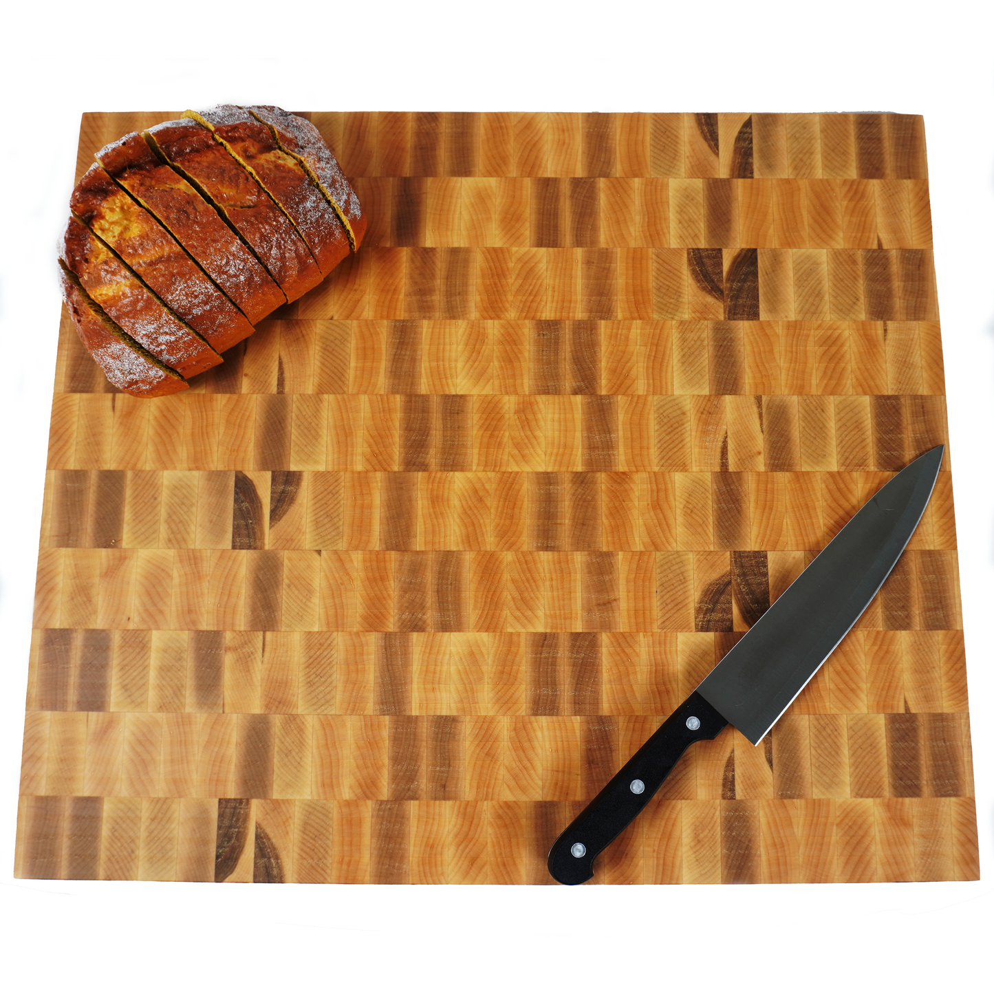 Top down view of maple end grain cutting board with sliced bread and bread knife