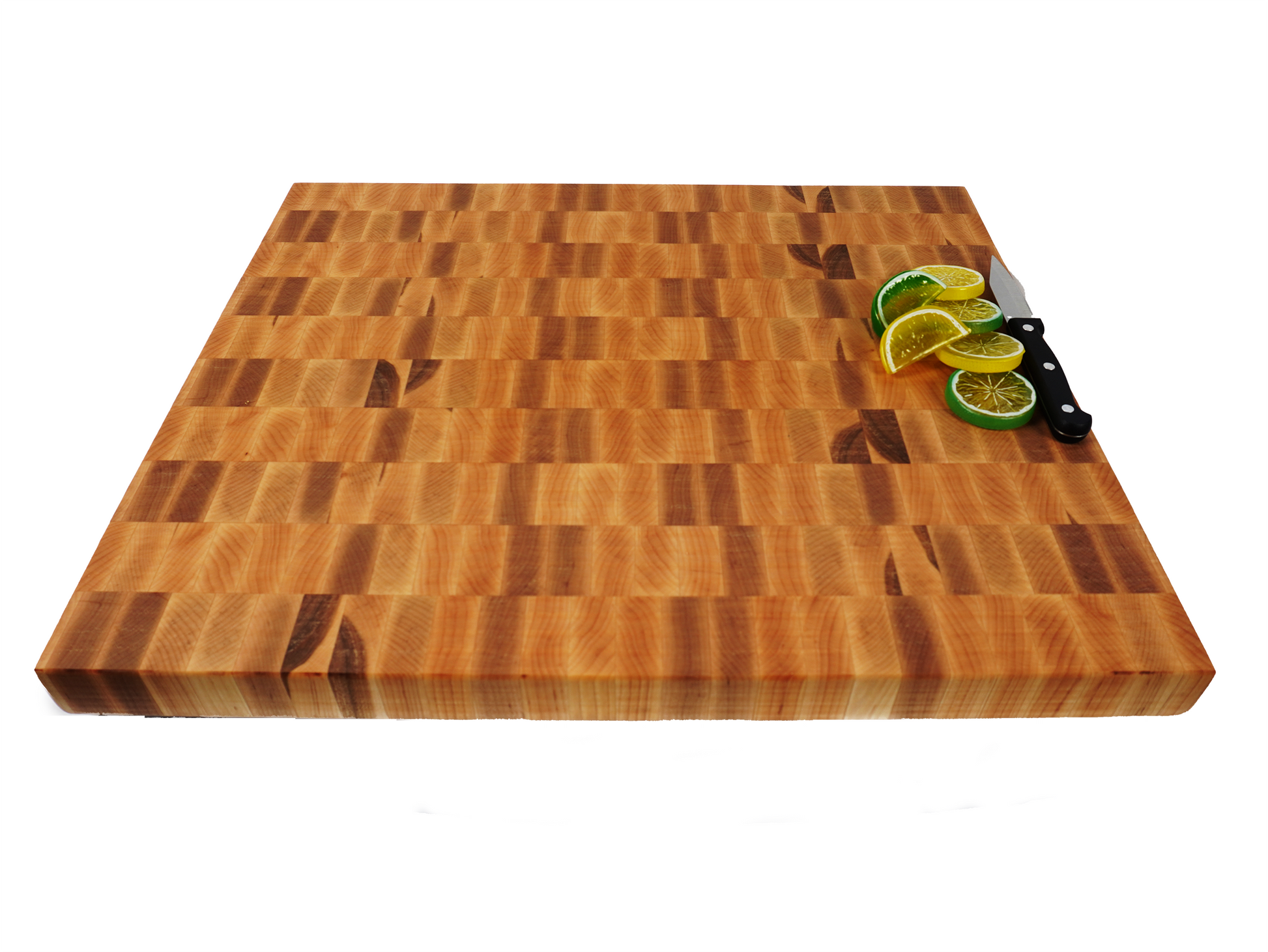 Maple end grain cutting board with lemons limes and chef knife at 45 degree angle
