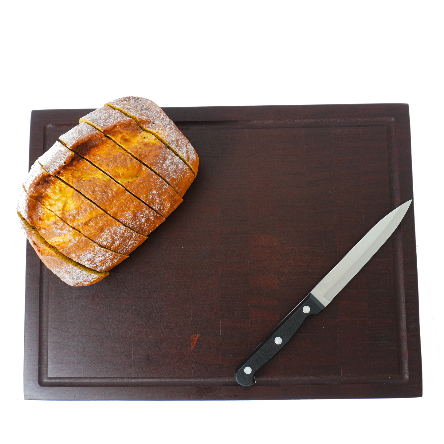 Overhead view of a loaf of bread on the Sapele board, showcasing its use for serving.