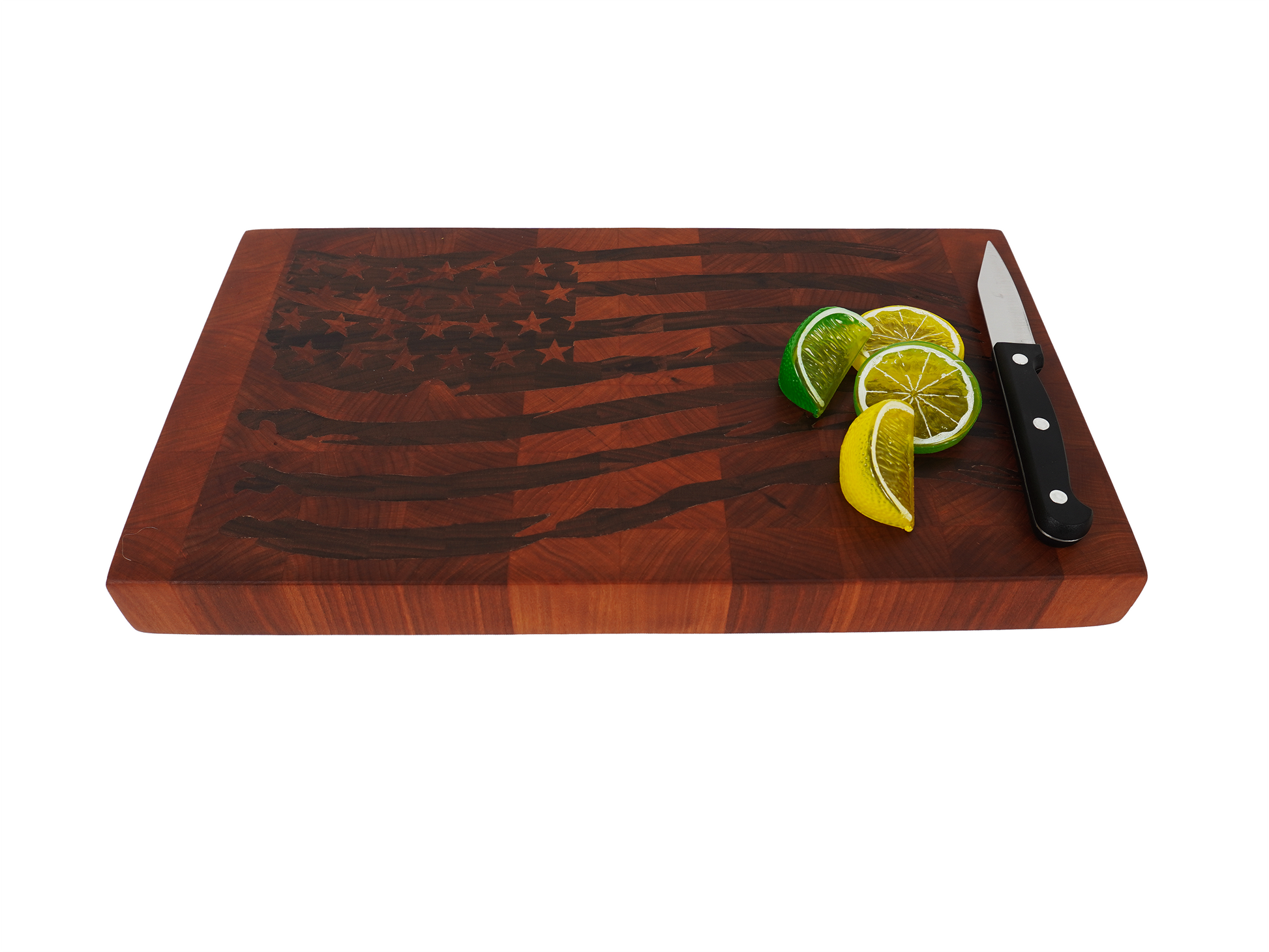 Tattered Glory Sovereign end grain cutting board angled view with lemons limes and chef knife, Black Walnut flag inlay maple board kitchen prep