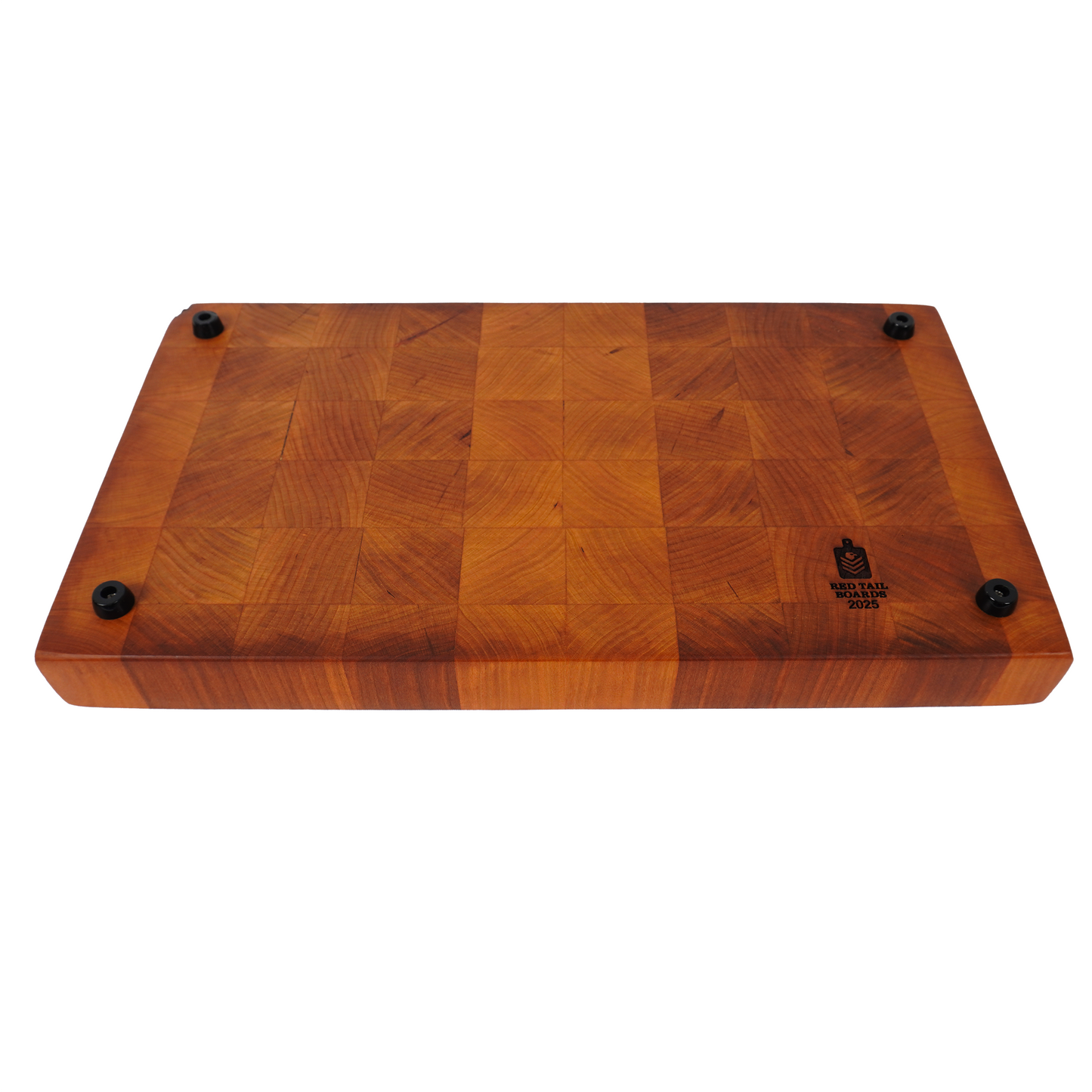 Underside of Tattered Glory Sovereign end grain cutting board showing professional grade non-slip rubber feet and end grain maple construction