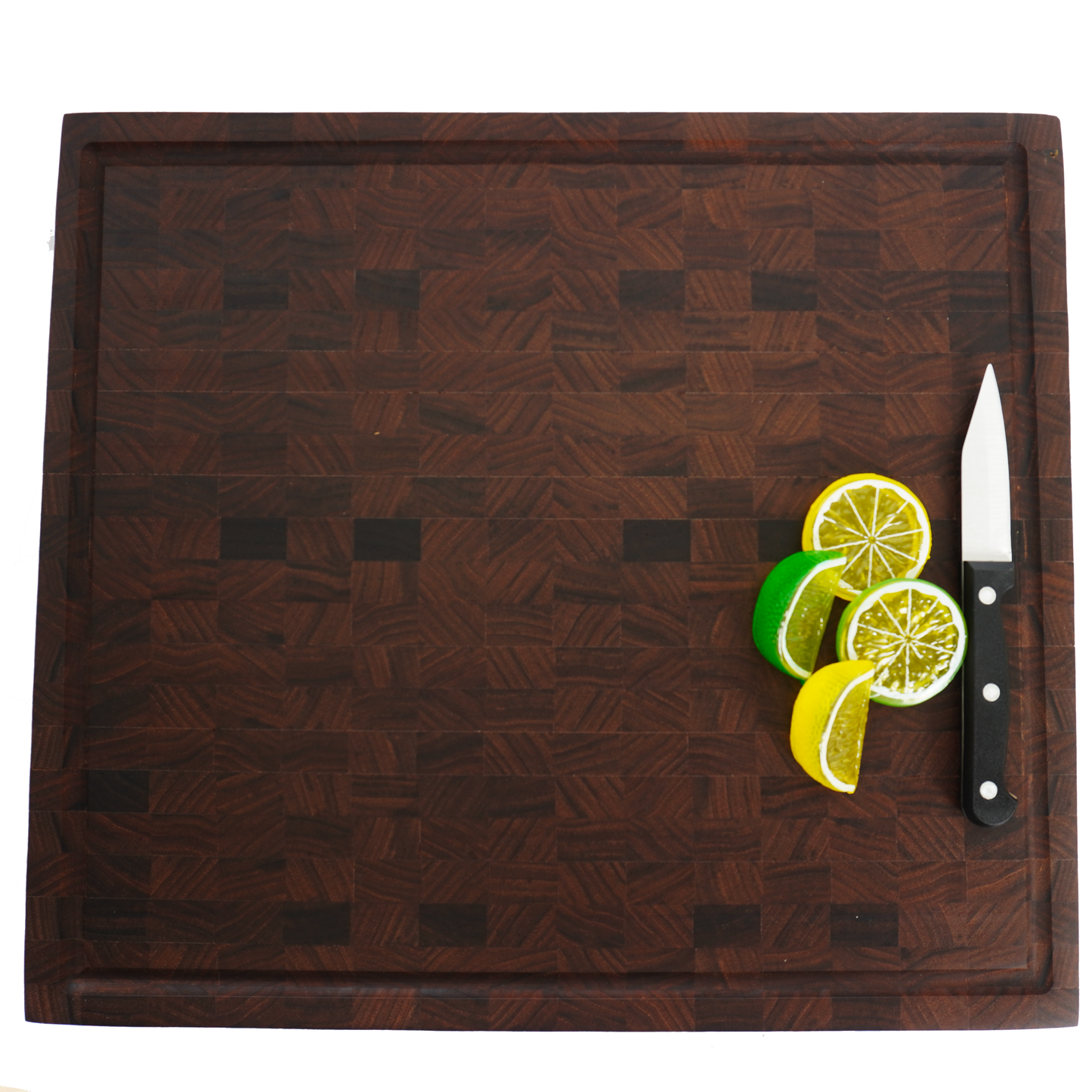 Eye-level shot of a Sovereign end grain board with citrus fruits, showcasing its moisture-resistant food-safe finish.